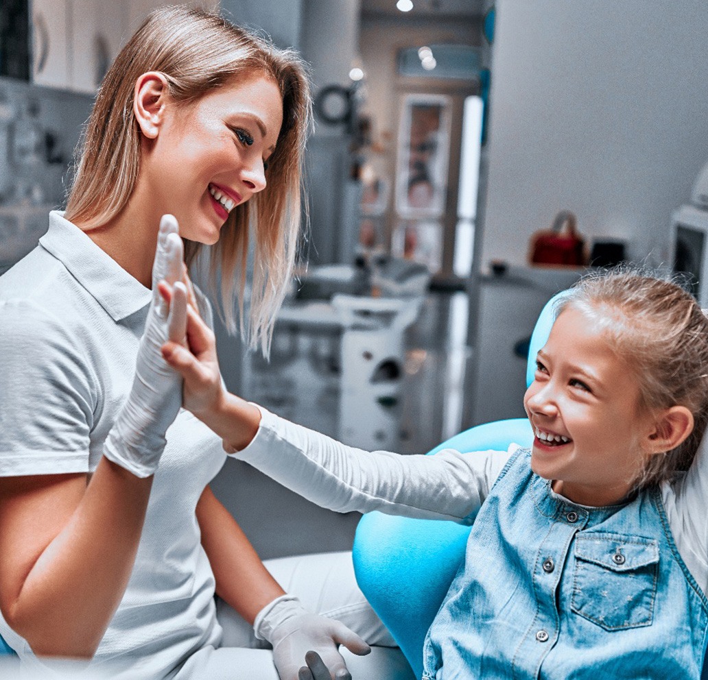 Pediatric dentist in Brandon examining young patient 