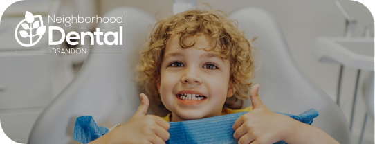 A child in a dentist chair at Neighborhood Dental, showcasing a friendly environment for pediatric dentistry.