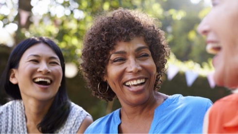 Three woman talking together outdoors