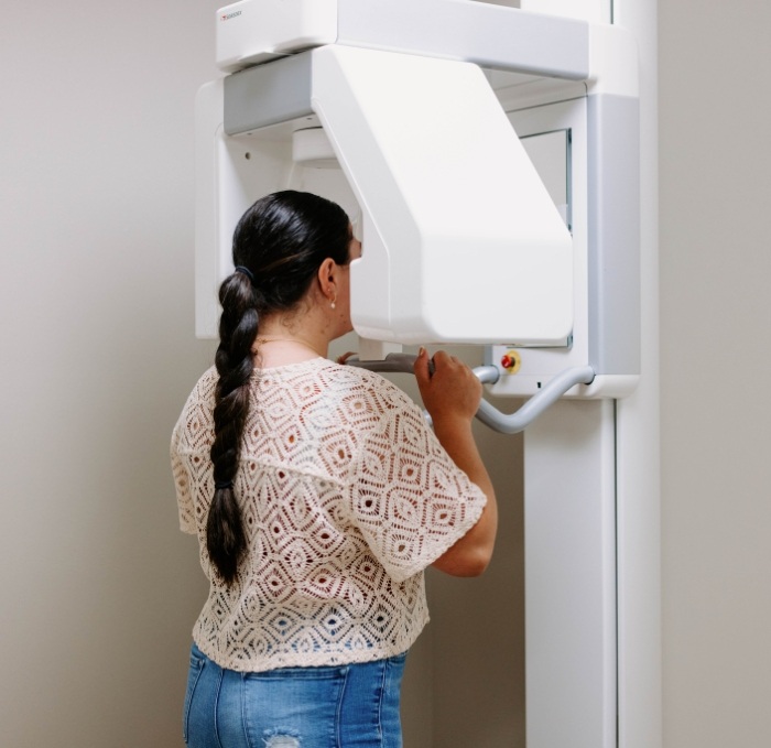 Dental patient having digital dental X rays taken of her mouth