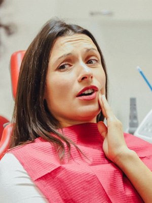 Patient talking to dentist about her tooth loss