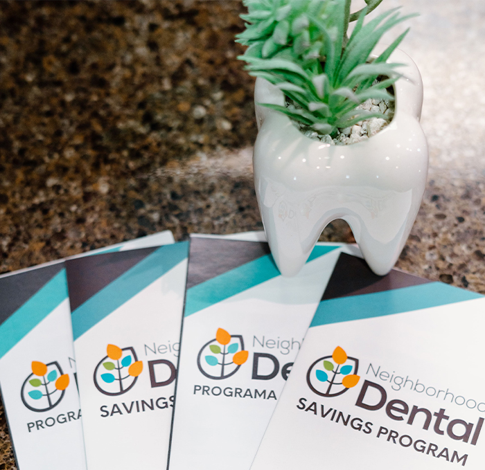 Brochues for Neighborhood Dental Brandon savings plan on table