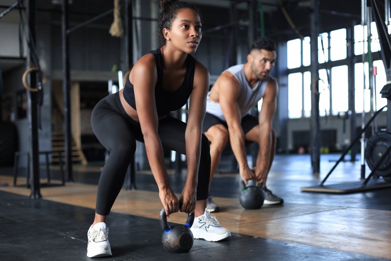 two people working out in a gym 